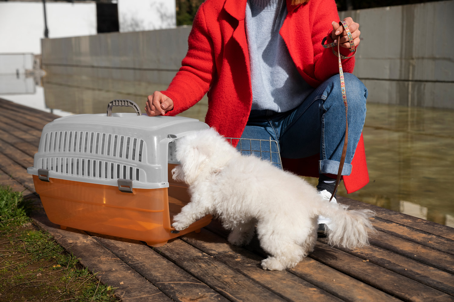 Dog owner with pet carrier Front view owner with pet carrier